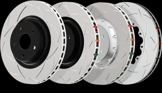 Multiple DBA slotted brake rotors displayed showing different slot patterns and performance designs for enhanced braking